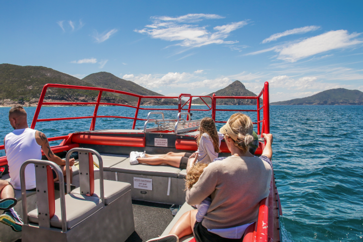 a group of people on a boat in the water
